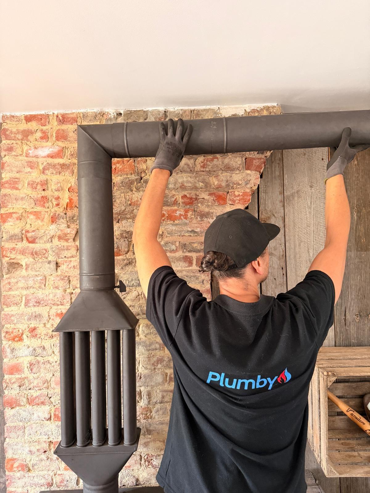 Plumby servicing a wood-stove flue — Ramonage in Luxemburg